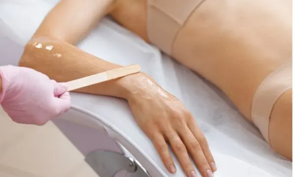 Sugar paste being applied to an arm